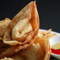 Crab Rangoon · Six pieces. Deep-fried pastry, snow crab, cream cheese, red bell peppers, and green onion.