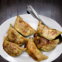 Vegan Gyoza · Six pieces. Spice infused soy curls, shiitake, napa cabbage, and pan-fried to a golden brown.