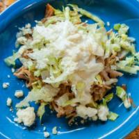 Sopes · 2 corn mill tortillas topped with refried beans, choice of meat , lettuce, queso fresco & so...