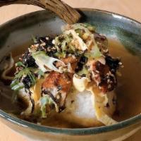 Unagi Yaki Onigiri Chazuke · Grilled rice ball in light dashi broth topped with grilled eel, seaweed, and wasabi.