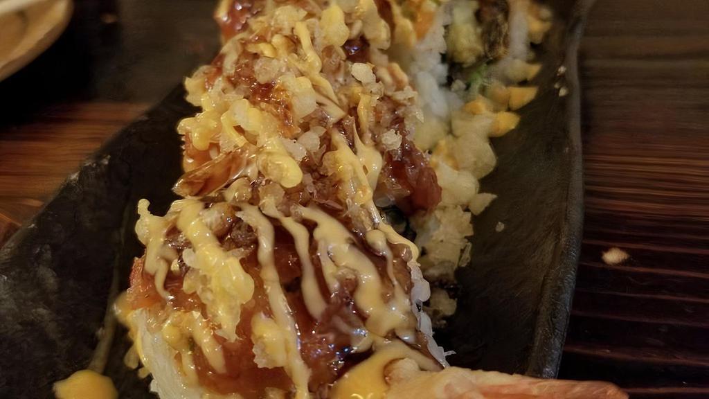 Show Roll · Shrimp tempura, eel, and avocado, topped with spicy tuna and  tempura bits, drizzled with spicy mayo and eel sauce.