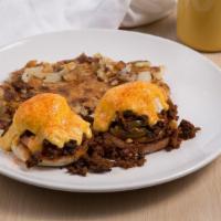 Chicano Benedict · Toasted English muffin, tomato, housemade chorizo, poached eggs, hollandaise sauce, and jala...