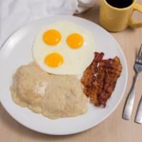 Country Breakfast · Three fresh cracked eggs any style, choice of three bacon or three sausage links, and a home...