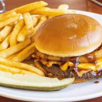 Western Bacon Cheeseburger · Spice up a classic with tangy BBQ sauce, crispy onion rings, bacon, and melted cheddar cheese.