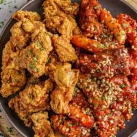 Large Fried Chicken (1 Or 2 Flavors) · 800g (1.7lbs) of crispy boneless or 26 pcs of classic bone-in wings with your choice of one ...