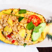 Pineapple Fried Rice · With chicken, shrimp, egg, cashew nut, pineapple chunks, tomato, and onion. Shrimp add $2.00