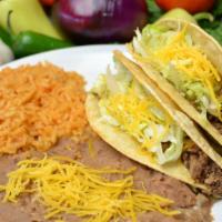 #3. 2 Beef Tacos · 2 Beef Tacos with Lettuce and Cheese.  All combos include Rice and Beans with Cheese