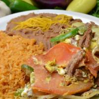 Machaca Breakfast Platter · Served with 2 eggs, tortilla, rice, and beans.