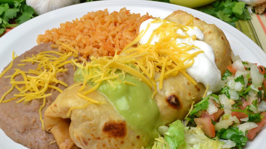 #19. Chimichanga Plate · Shredded Beef mixed with Onion, Tomato and Bell Peppers, Beans and Cheese, Guacamole, Sour Cream, Cheese, Lettuce and Pico de Gallo. Rice and Beans are included