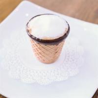 Macchiato · Two shots of espresso with a dollop of foam in a dark chocolate dipped waffle cone. (the siz...