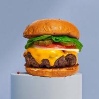 Dapper Cheddar Burger · Taste the American Dream with our juicy American beef patty cooked medium and served on grid...