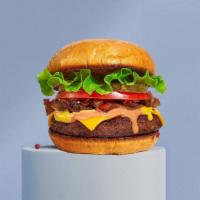 She'S A Classic Burger · Taste the American Dream with our juicy American beef patty cooked medium and served on grid...