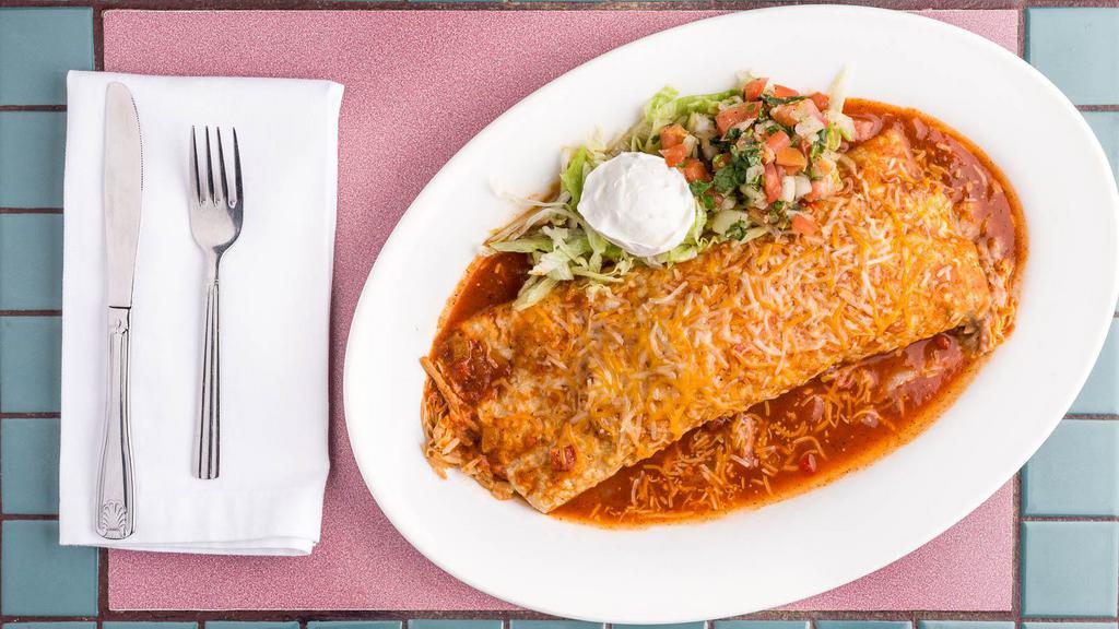 Santa Fe Burrito · Filled with rice, beans grounded beef or chicken. Topped with melted cheese, lettuce, onions, tomatoes and sour cream.