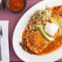 Burrito Al Pastor · Marinated pork, filled with rice, beans and topped with melted cheese and sauce, avocado, so...