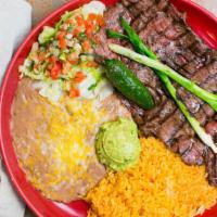 Carne Asada · Thin slices of skirt steak cooked over charcoal. Served with pico de gallo, guacamole, rice,...