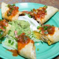 Chicken Taquitos · Flour tortilla, filled with chicken and cheese. Served with lettuce, guacamole, sour cream, ...