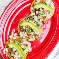 Tostadas De Ceviche (3) · Ground white fish marinated in lime juice, diced tomatoes, avocado, onion, cilantro and jala...