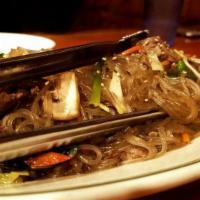 Japchae · Sweet and savory stir-fried glass noodles with beef and assorted vegetables.