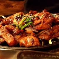 Dwaeji Bulgogi · Specially marinated pork served over sizzling onion.