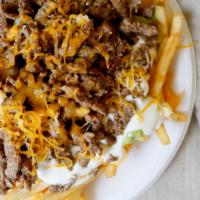 Carne Asada Fries · French Fries topped with Steak,Guacamole,Sour Cream,Cheese