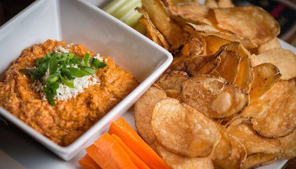 Buffalo Chicken Dip · If you can’t handle it, don’t order it! No refunds! shredded buffalo chicken / cheddar / bleu cheese crumbles / green onions / chips / veggies.