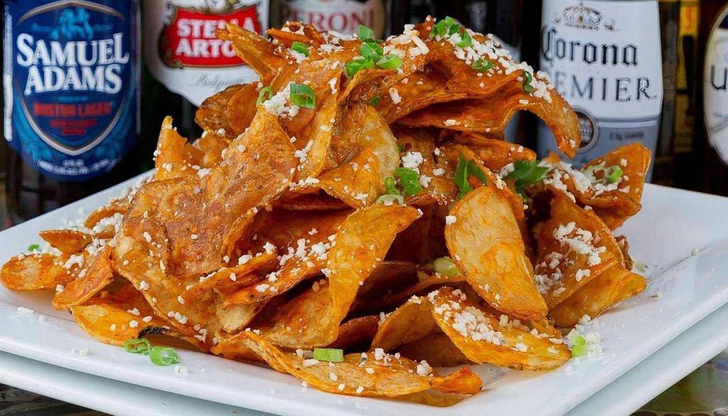 Hell Fire Chips · If you can’t handle it, don’t order it! No refunds! chips / buffalo sauce / bleu cheese crumbles / green onions.