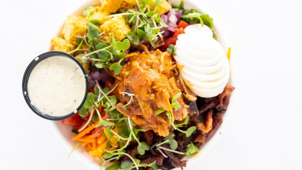 Pork Or Chicken Cobb Salad · Smoked pulled pork or chicken tossed with Hazy IPA BBQ sauce or smoked trout, mixed greens, carrots, house-smoked bacon, shredded cheese, red onion, hard-boiled egg, fresh diced tomatoes, served with cornbread croutons, and roasted poblano ranch.