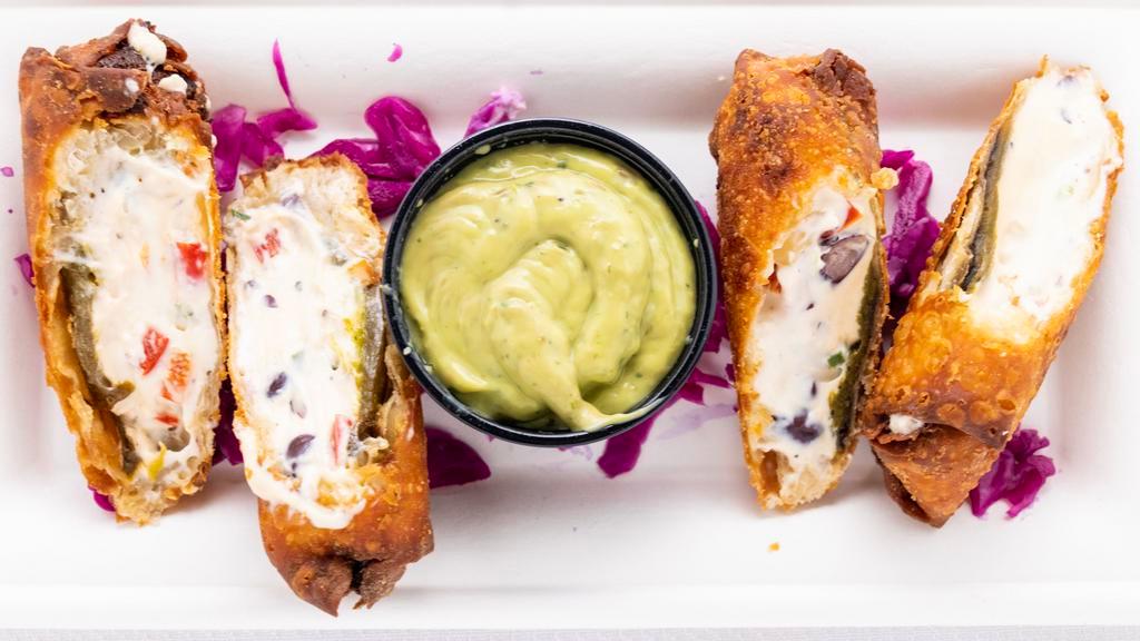 Jalapeno Popper Eggrolls · 2 large egg rolls cut to share, served with a buttermilk avocado dipping sauce.