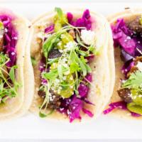 Street Tacos · Three tacos topped with pickled slaw, chimichurri, cotija cheese, and micro cilantro. Choice...
