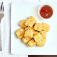 Golden Tofu · Cubes of tofu fried till golden brown. Served with soy dipping sauce.