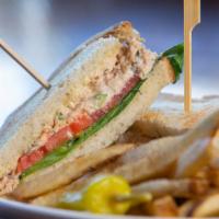Dilly Tuna Salad Sandwich · Creamy albacore tuna salad blended with celery, red onion, and fresh dill on toasted sourdou...