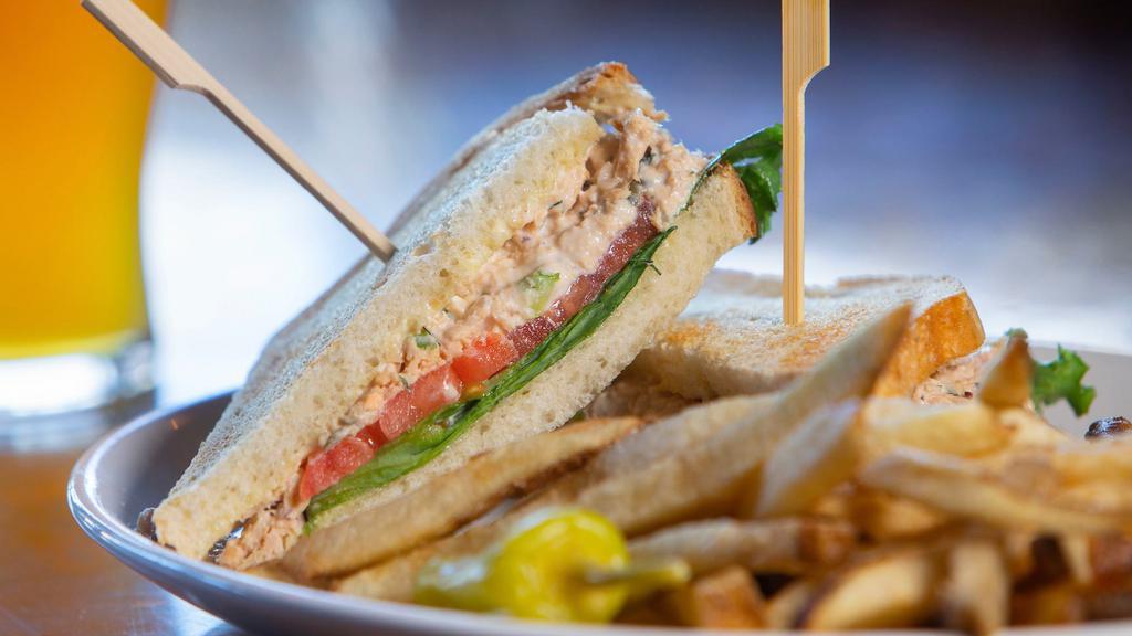 Dilly Tuna Salad (Full) · creamy albacore tuna salad with celery, red onion & dill on toasted sourdough with lettuce, tomato & pickles