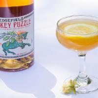 Monkey Punch · Monkey Puzzle whiskey, Pama liqueur, fresh-squeezed lemon and orange juice