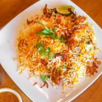 Hyderabadi Chicken Dum Biryani · House special rice dish made with aromatic rice and chef's secret ingredients slow cooked ov...