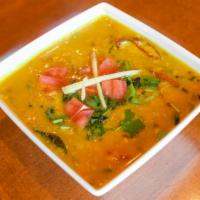 Tadka Dal Fry · Boiled yellow lentil tempered with cumin, mustard, garlic and curry leaves.