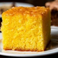 Lemon Cake · Our zesty lemon cake is bursting with flavor and moist throughout.