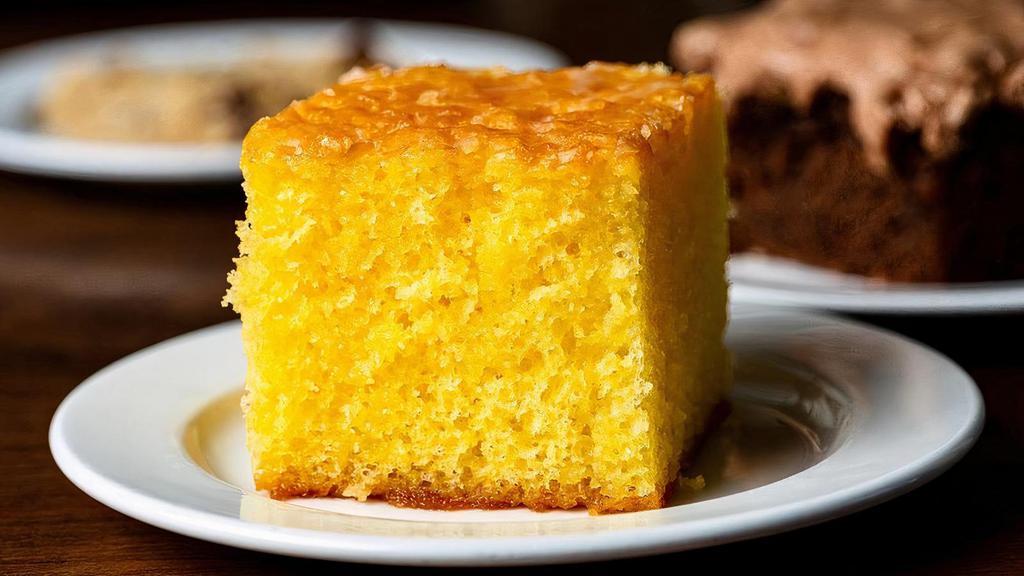 Lemon Cake · Our zesty lemon cake is bursting with flavor and moist throughout.