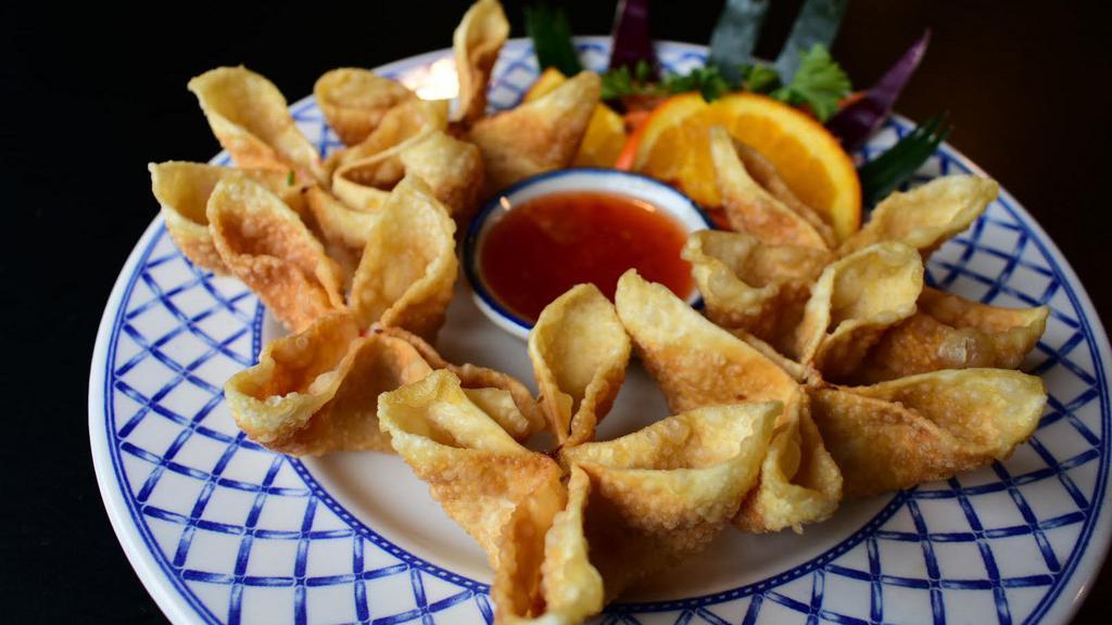 Crab Delight · wonton stuffed with snow crab, cream cheese
served with sweet chili sauce