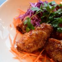 Makaam Wings · fried chicken wings tossed in sweet and
tangy tamarind sauce