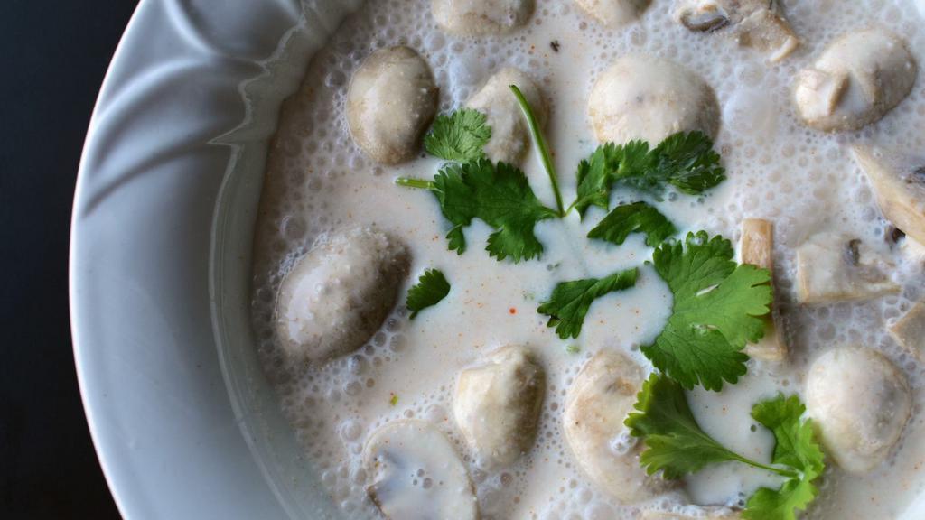 Tom Kha Soup · Hot and sour soup, coconut milk, lemongrass, kaffir lime leaf, galangal, mushrooms, and cilantro. Choice of meat.