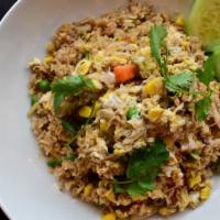 Crab Fried Rice · Egg, crab meat, carrots, peas, corn, cilantro, tomatoes and fresh cucumber. Choice of meat.