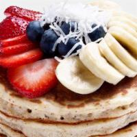 Mayra'S Vegan Protein Pancakes · Organic House-made Pancakes topped with Blueberries, Strawberries, Banana and Coconut