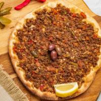 Lahma Bi Ajeen · Ground beef, tomato, onion, green peppers, and spices.