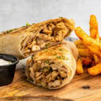 Chicken Shawarma · Chicken shawarma wrapped in freshly baked saj bread stuffed pickles, tomatoes, and a very sp...