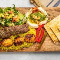 Mixed Kebab · 1 beef kebab and chicken tikka kebab, seasoned with onions and spices. Comes on a bed of ric...
