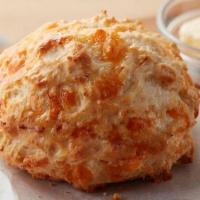 Cheddar Biscuit · Scratch made dough that is dropped like its hot. This biscuit will melt in your mouth with a...