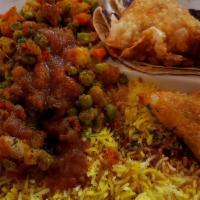 Kenyan Vegan/Veggie Platter · Delightful combo mix of samosas, chapati, tumeric rice, veggie curry, and delicious red lent...
