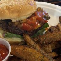 Moroccan Lamb Burger · Hand formed and seasoned lamb patty with tomatoes, lettuce, and with house-made tomato chutney