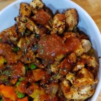 Grilled Chicken Rice Bowl · Grilled Chicken on a bed of rice  topped with house-made tomato chutney