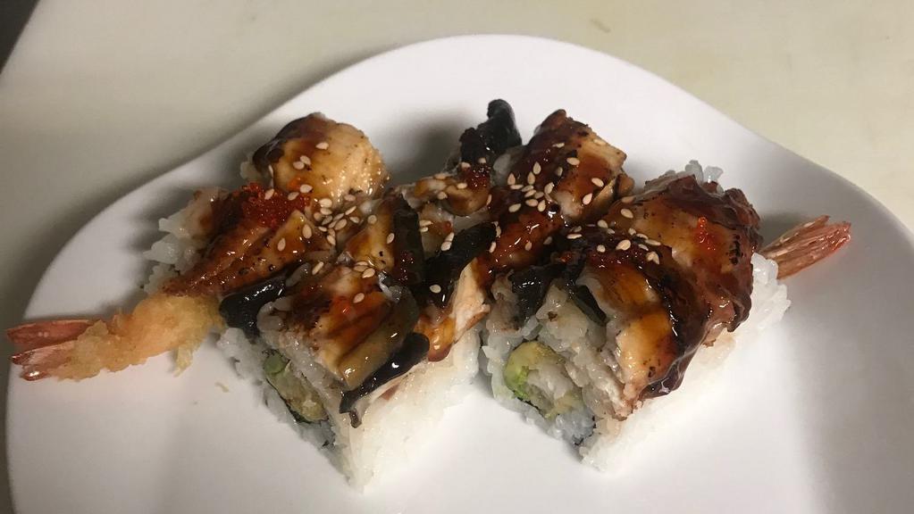 Godzilla Roll · Shrimp tempura ,avocado topped with eel ,tobiko and eel sauce